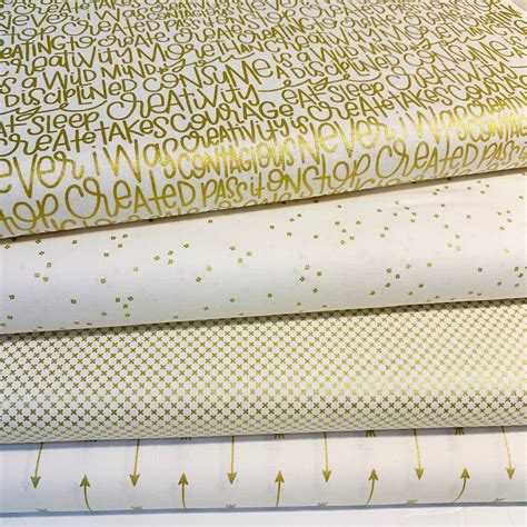 fabric with metallic gold|white fabric with gold accents.